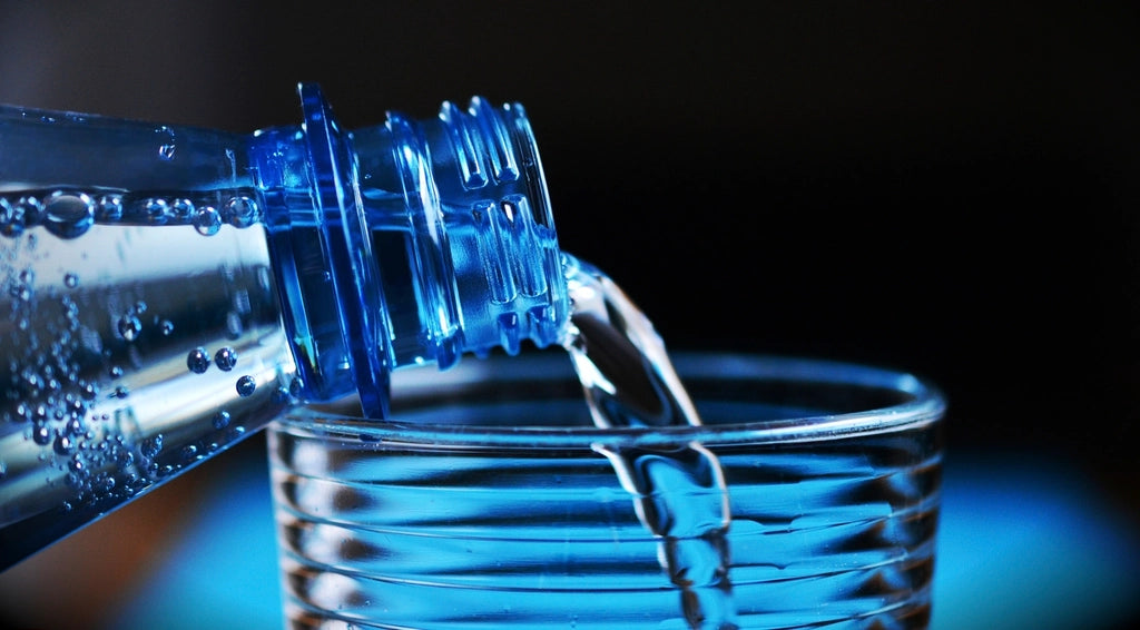Water being poured into a clear glass