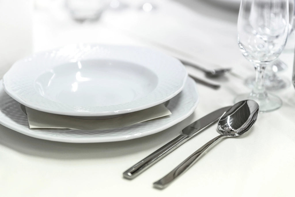 An elegant fine-dining restaurant table setting
